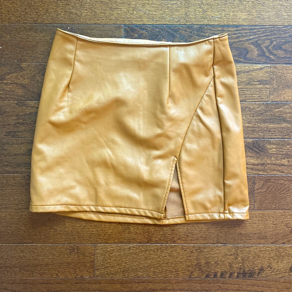 Pleather brown mini skirt. Super cute for fall/winter.